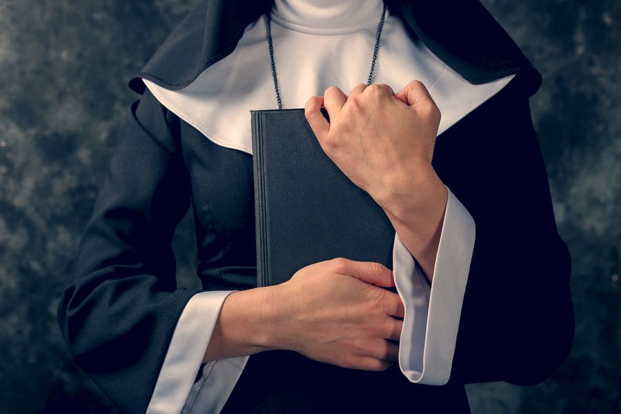 Nun holding bible